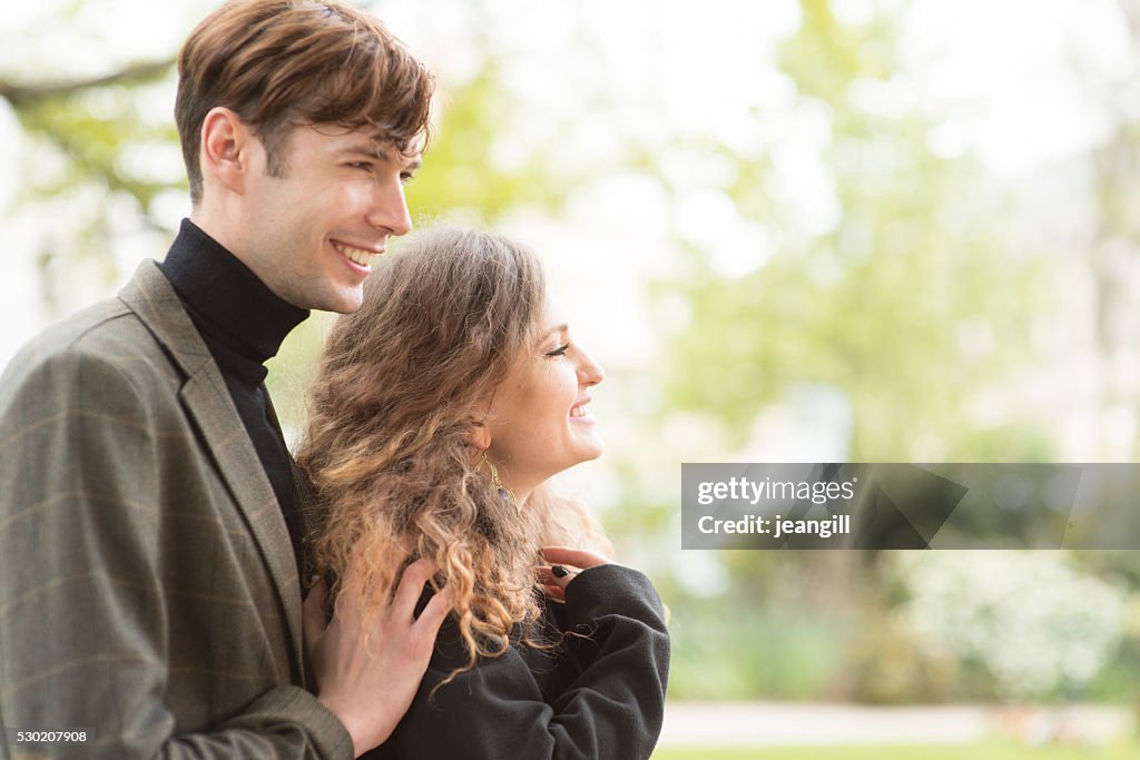 Young lovers in sunny park