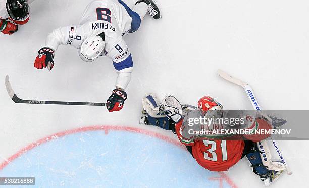 France's forward Charles Bertrand celebrate next to Hungary's goalie Miklos Rajna during the group B preliminary round game Hungary vs France at the...