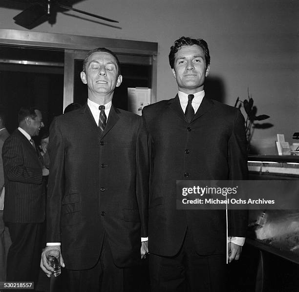 Writer/Producer Aaron Spelling and friend attend a party in Los Angeles,CA.