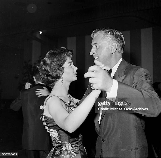 Actress Jean Simmons and husband actor Stewart Granger dance as they attend an event in Los Angeles,CA.