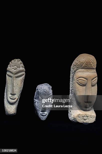 The three heads known as Gamma, Alpha, Beta that are believed to be attributed to Amedeo Modigliani are displayed in a bank vault on May 10, 2016 in...