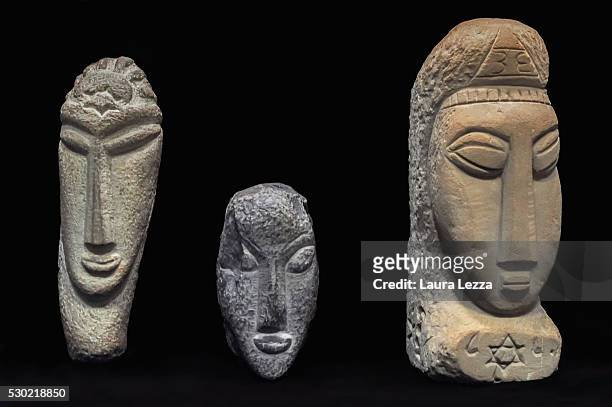 The three heads known as Gamma, Alpha, Beta that are believed to be attributed to Amedeo Modigliani are displayed in a bank vault on May 10, 2016 in...