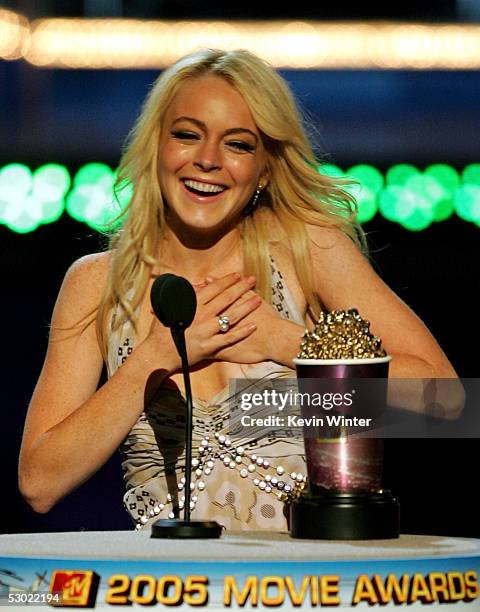 Actress Lindsay Lohan accepts her award for Best Female Performance for Mean Girls onstage during the 2005 MTV Movie Awards at the Shrine Auditorium...