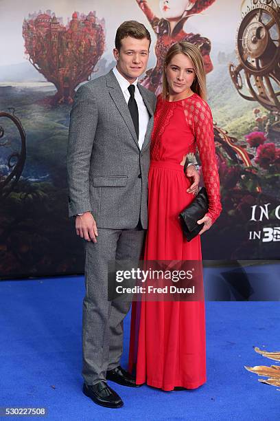 Ed Speleers and Asia Macey attend the UK Premiere of "Alice Through The Looking Glass" at Odeon Leicester Square on May 10, 2016 in London, England.