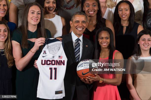 President Barack Obama poses with players Moriah Jefferson and Breanna Stewart at the White House in Washington, DC, May 10 during an event welcoming...