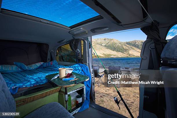 a campervan pulls into lake taylor campsite - new zealand beach house stock pictures, royalty-free photos & images