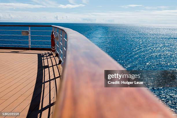 deck railing aboard cruise ship - imbarcazione per passeggeri foto e immagini stock