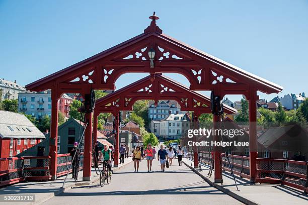pedestrians on gamle bybro old town bridge - trondheim stock pictures, royalty-free photos & images