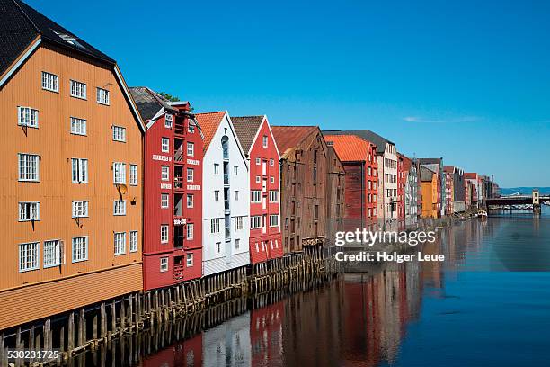colorful buildings of wharves along nidelva river - trondheim norway stock pictures, royalty-free photos & images