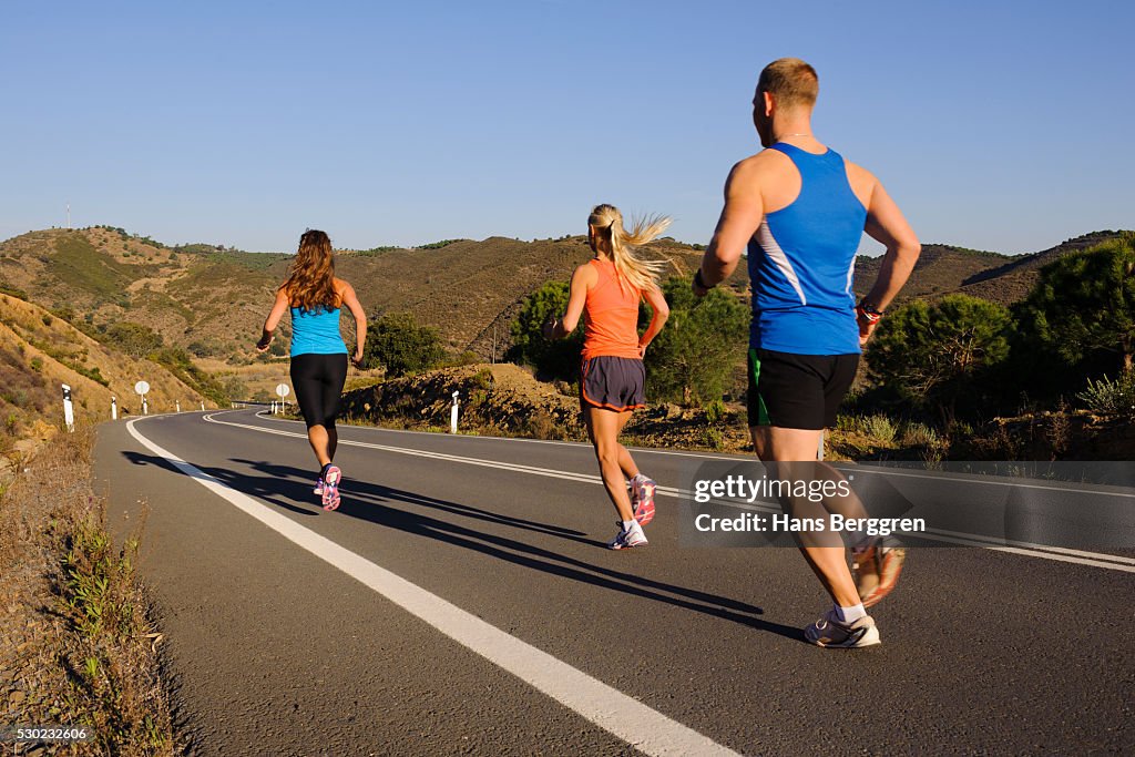 Running Roud Right Side Runners Running On Road High-Res Stock Photo - Getty Images