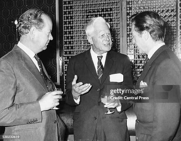 Members of the famous 617 RAF Dambusters Squadron sharing drinks at a screening of the film 'The Dam Busters', Flight Lieutenant D J Shannon and Dr...