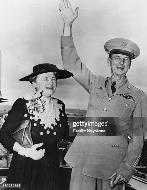 General Jonathan M Wainwright, with his wife, waiving to crowds as he arrives in Washington D C, October 9th 1945.