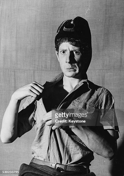 Portrait of actor, director and comedian Jonathan Miller, wearing a makeshift military uniform during his time at Cambridge University in the...