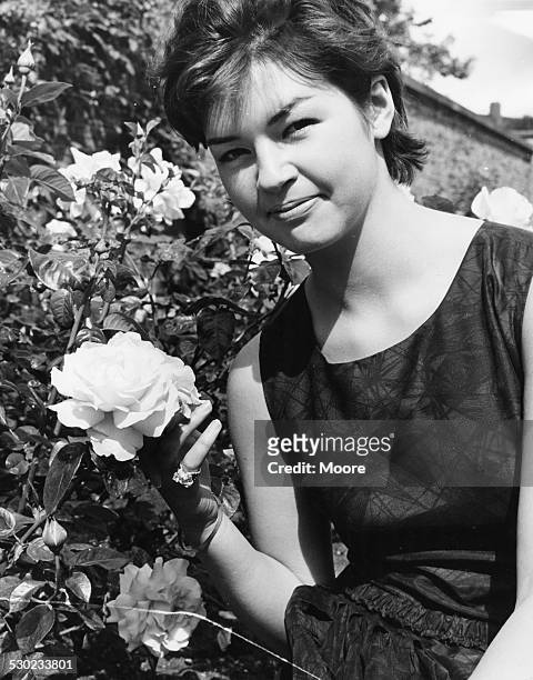 Portrait of actress Mandy Miller, former child star, posing in the garden of the BBC Television Centre, filming 'Out of the Rain', London, July 22nd...