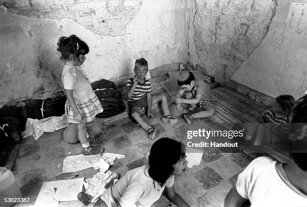 Young Jewish children ger ready for their afternoon nap where right-wing Israeli settlers have fenced in the old railway station in an initial...