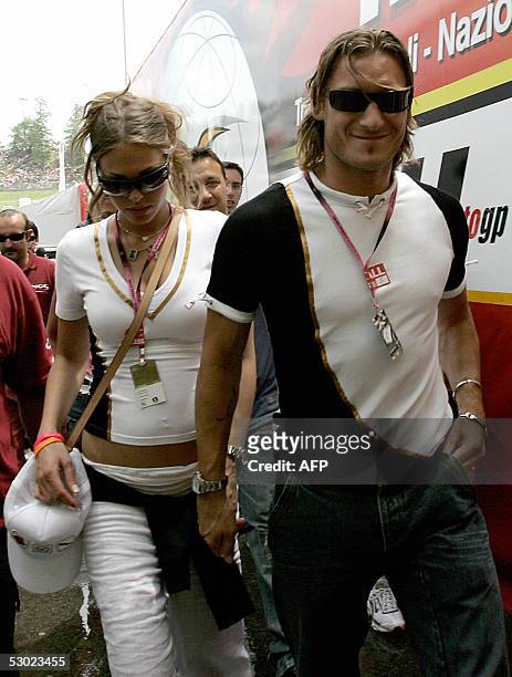 Roma "Capitano" Francesco Totti arrives with his girlfriend Ilary at Mugello's race track to follow Italian Grand Prix, 05 June 2005. Valentino Rossi...