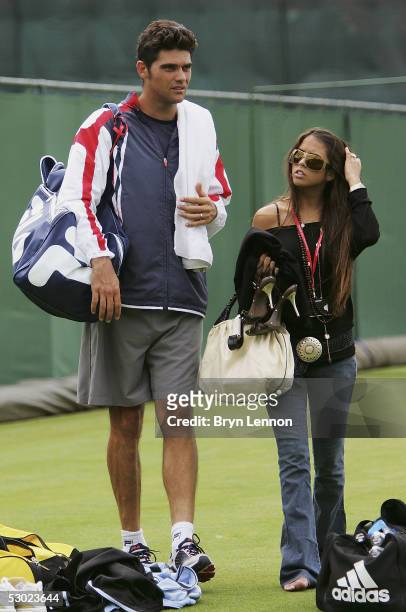Mark Philippoussis of Australia and his girlfriend Alexis Barbara leave the court after practice for the Stella Artois Championships at Queen's Club...