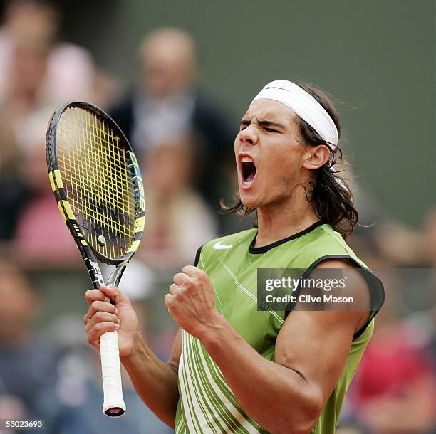 Rafael Nadal of Spain celebrates winning a point against Mariano Puerta of Argentina during the Mens Final match on the fourteenth day of the French...