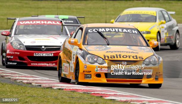 Matt Neal of England drives the Team Halfords Honda Integra during round 8 of the Dunlop MSA British Touring Car Championship race held at the Brands...