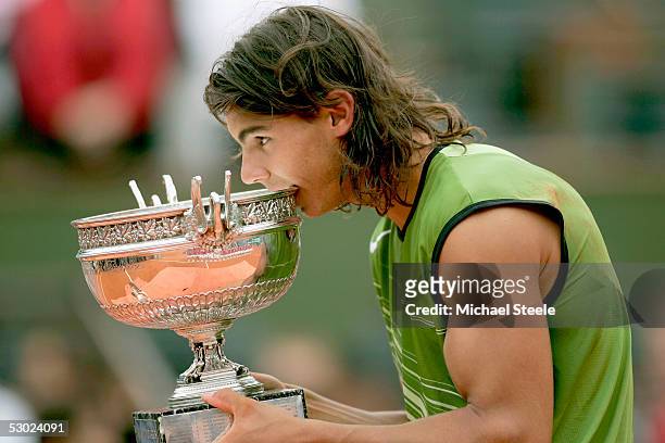 Rafael Nadal of Spain poses with the winners trophy after his 3-1 sets victory over Mariano Puerta of Argentina during the Mens Final match during...