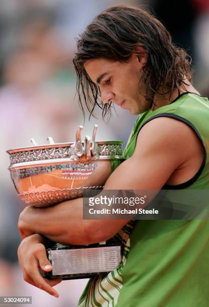 Rafael Nadal of Spain poses with the winners trophy after his 3-1 set victory over Mariano Puerta of Argentina in the Mens Final match during the...