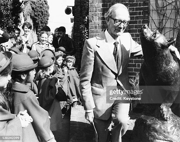 Author Christopher Robin Milne unveiling a statue of a bear, in honor of his father, AA Milne, and his creation, Winnie the Pooh, at London Zoo,...