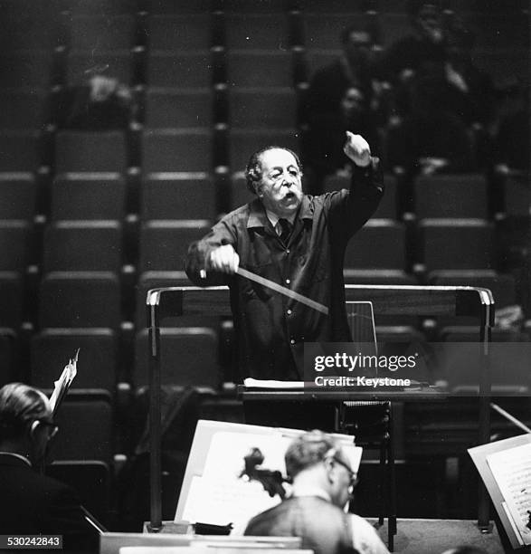 Conductor Pierre Monteux, leading the London Philharmonic Orchestra during rehearsals, at the Royal Festival Hall, London, December 6th 1961.