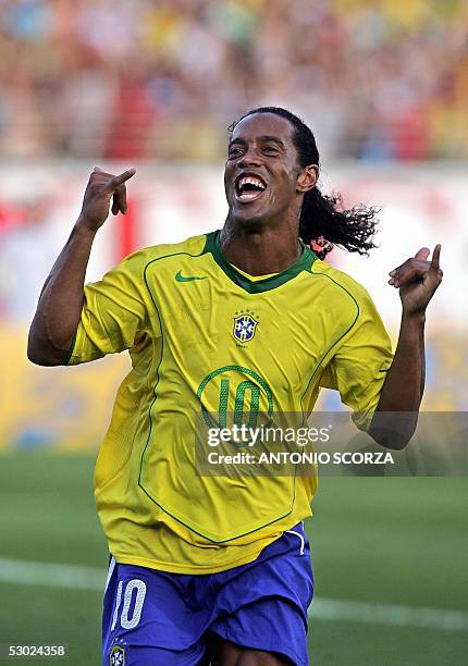 Brazilian Ronaldinho Gaucho celebrates after scoring a penalty against Paraguay, 05 June 2005, during their Germany 2006 FIFA World Cup South...