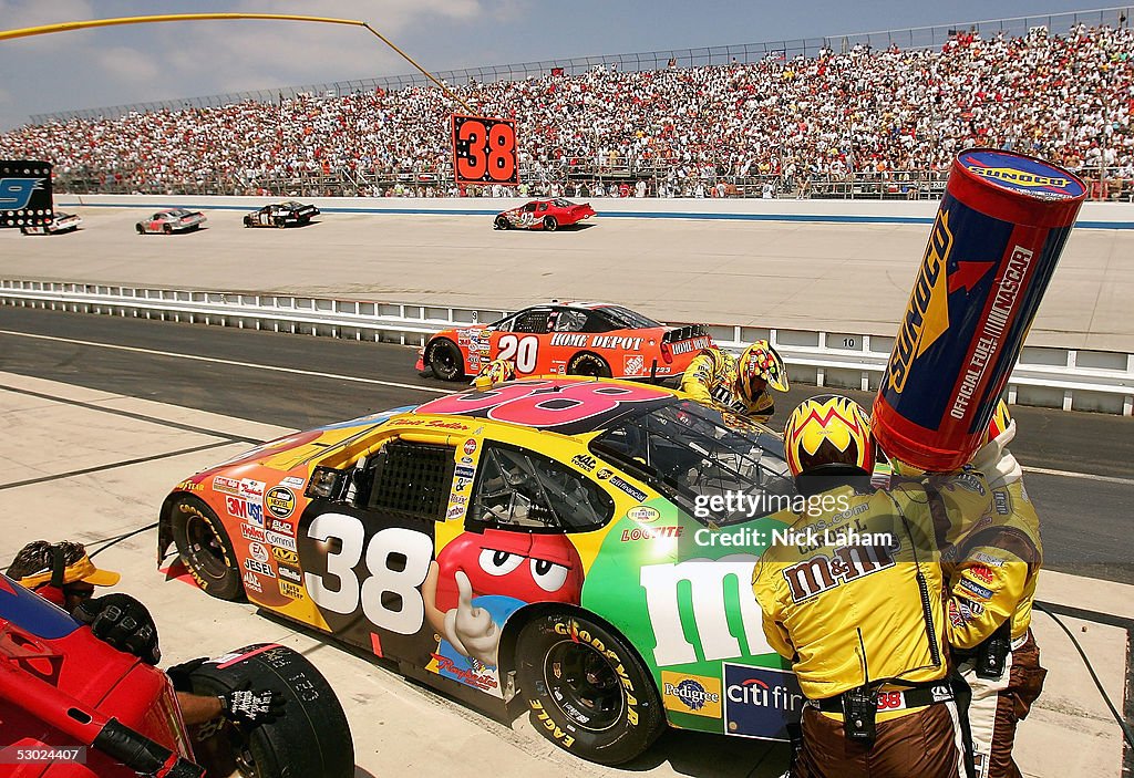 Mbna Racing Elliott Sadler driver of the M&M's Ford makes a pit stop during the ...