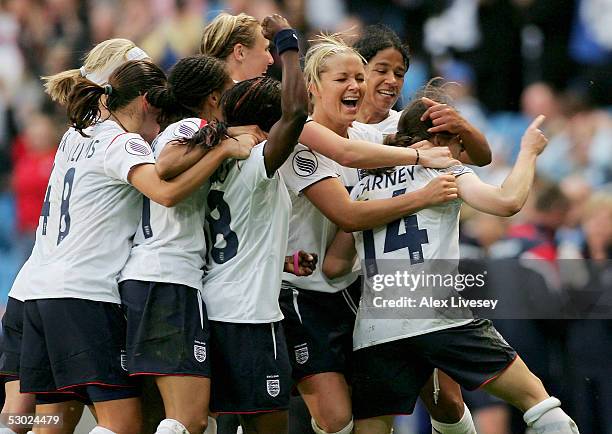 Karen Carney of England celebrates scoring the winning goal against Finland with her teammates during the Women's UEFA European Championship 2005...