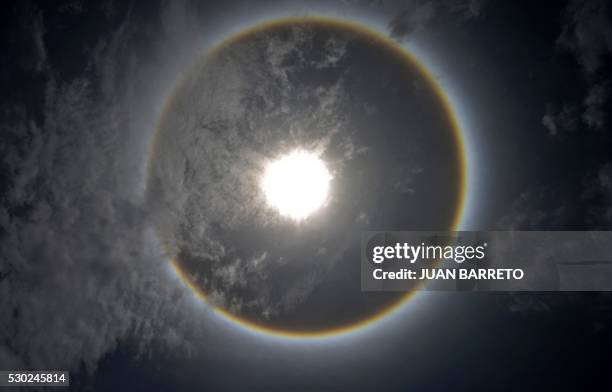 Halo is seen in teh sky in Caracas on May 10, 2016. The halo is an optical phenomenon produced when light interacts with ice crystals suspended in...