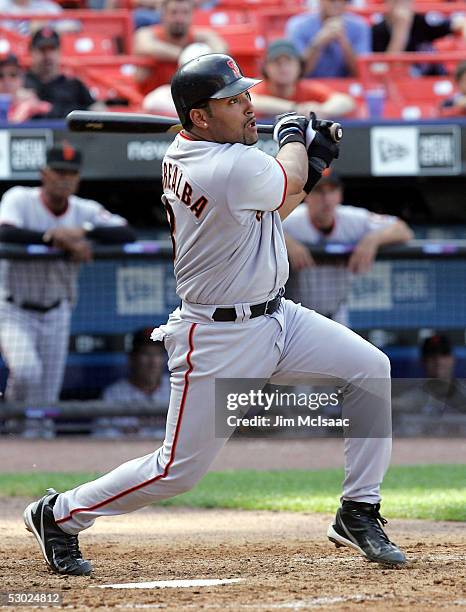 Yorvit Torrealba of the San Francisco Giants hits a ground-rule double in the fifth inning against the New York Mets during the first game of their...