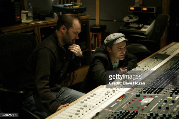 Producer Nigel Godrich and Fran Healy of Scottish pop group Travis at the mixing desk at Air Studios, London, during recording of the Band Aid 20...
