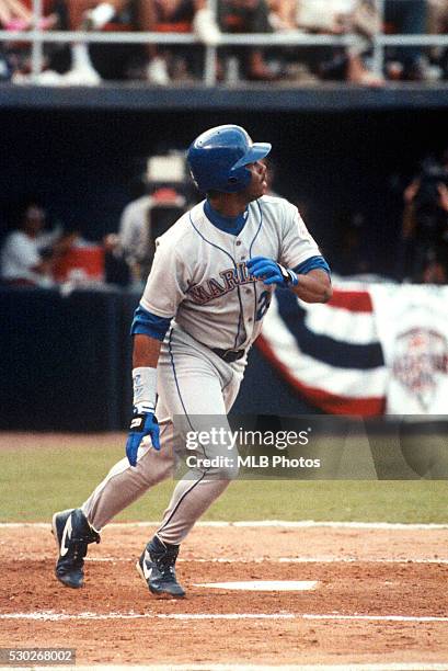 Ken Griffey Jr. #24 of the Seattle Mariners hits a home run in the top of the third inning off of Greg Maddux of the Chicago Cubs during the 63rd...