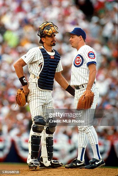 Benito Santiago of the San Diego Padres and Greg Maddux of the Chicago Cubs meet on the mound during the 63rd Major League Baseball All-Star Game at...