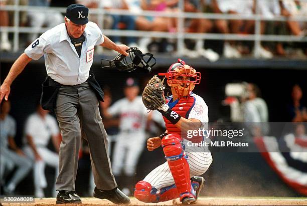 Benito Santiago of the San Diego Padres picks the ball out of the dirt during the 63rd Major League Baseball All-Star Game at Jack Murphy Stadium on...