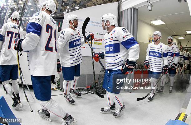 Pierre-Edouard Bellemare of France reacts with Laurent Meunier and teamattes during the 2016 IIHF World Championship between France and Hungary at...