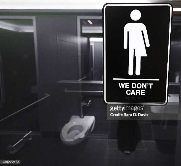 Gender neutral signs are posted in the 21C Museum Hotel public restrooms on May 10, 2016 in Durham, North Carolina. Debate over transgender bathroom...