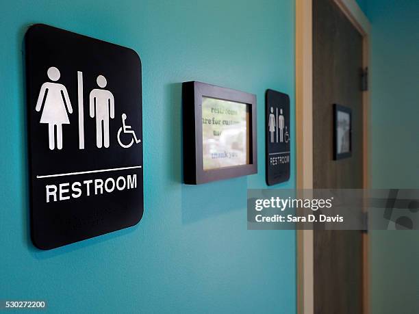 Unisex signs hang outside bathrooms at Toast Paninoteca on May 10, 2016 in Durham, North Carolina. Debate over transgender bathroom access spreads...