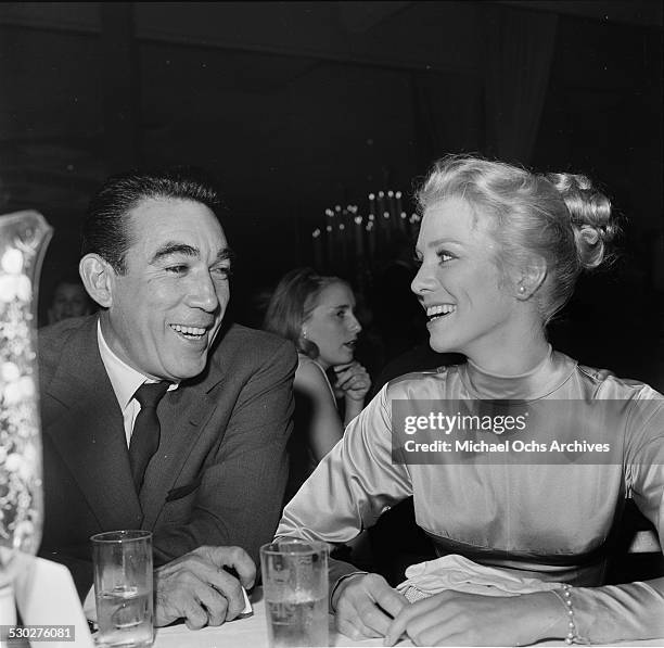 Actor Anthony Quinn talks with Tex Ritter's wife Dorothy Fay during the Cinema Editors Awards in Los Angeles,CA.