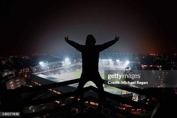 West Ham fans sings as he looks on from his vantage point during the Barclays Premier League match between West Ham United and Manchester United at...