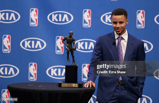 Stephen Curry of the Golden State Warriors is awarded the NBA Most Valuable Player Award by a first-ever unanimous vote during a press conference at...