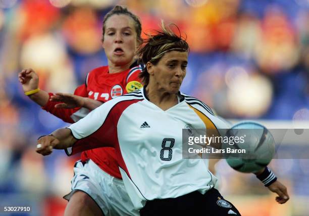 Marianne Paulsen from Norway in action with Sandra Smisek from Germany during the UEFA Women's Championship group B preliminary match between Germany...