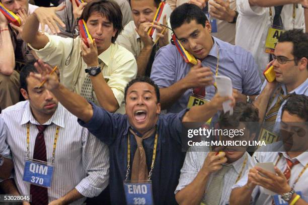 Brazilian stock traders negociate the buying and selling of the future dollar during the afternoon trading session at the Futures and Commodities...