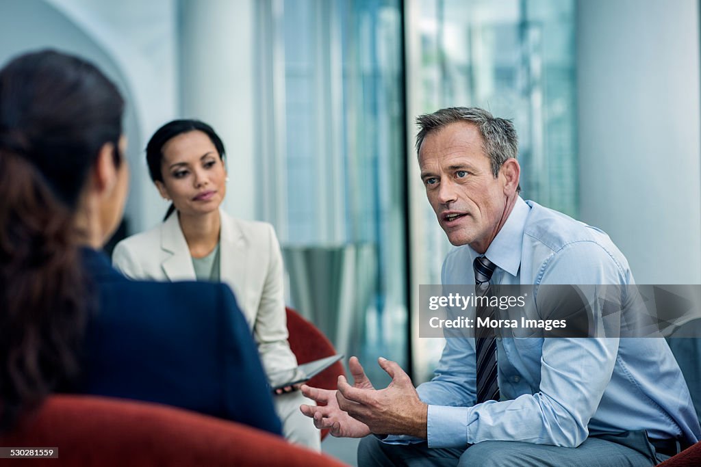 Businessman discussing strategy with colleagues
