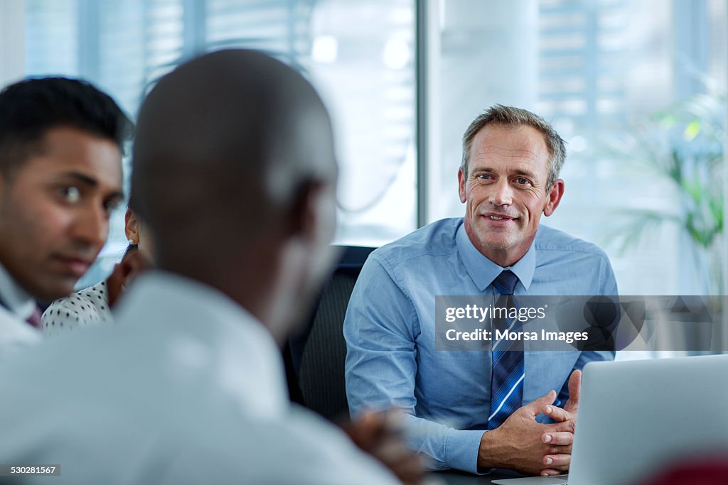 Businesspeople discussing strategy in office