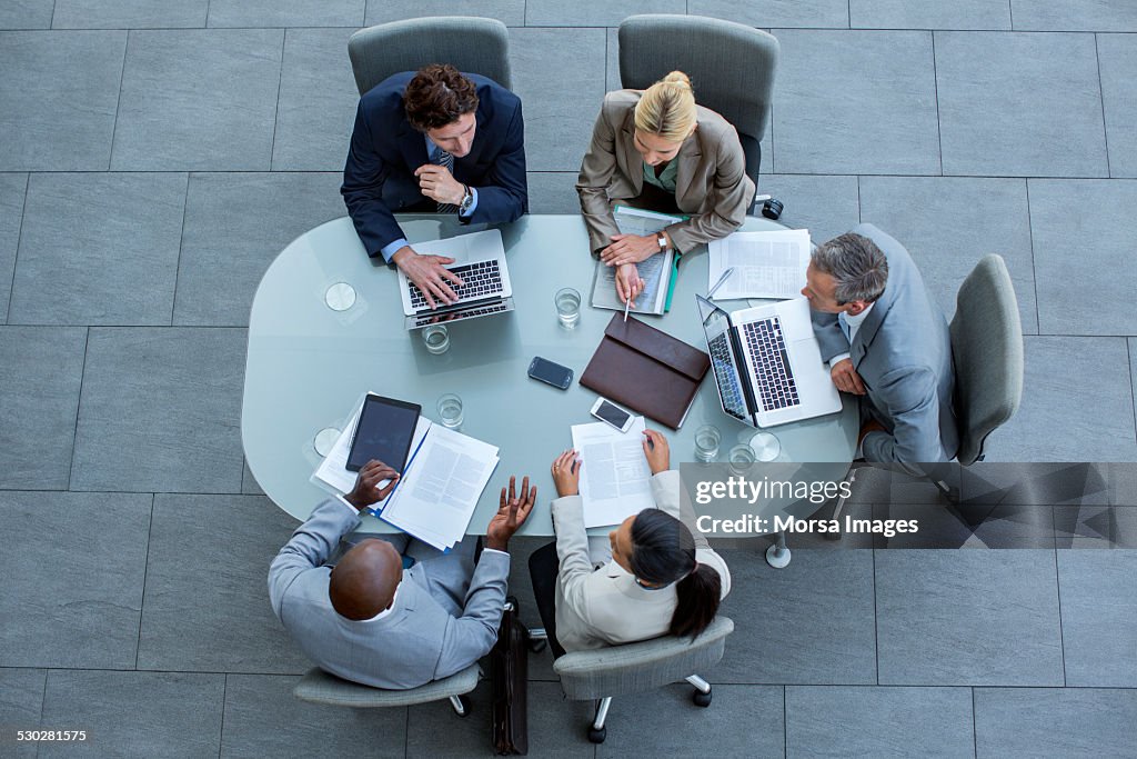 Businesspeople working at conference table