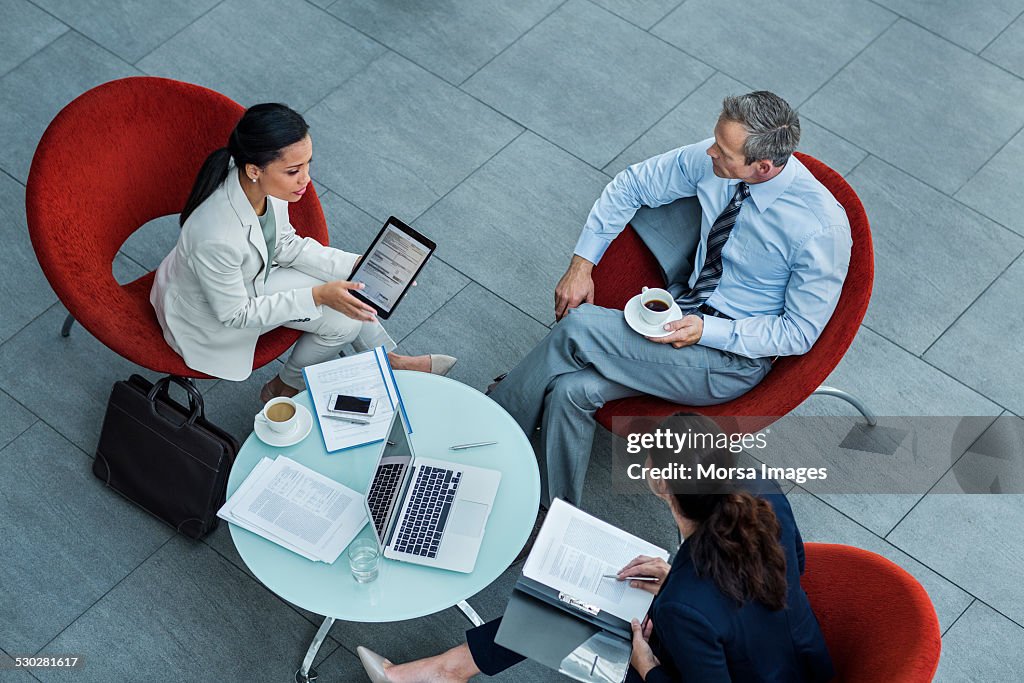 Businesspeople discussing strategy in office