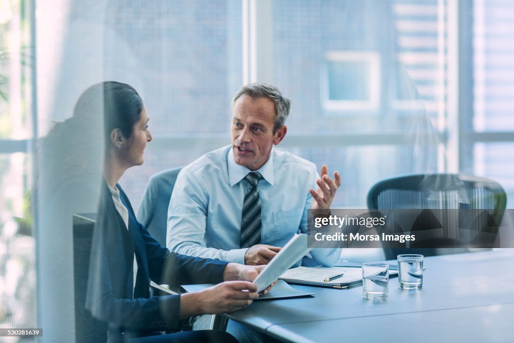 Businesspeople discussing strategy in office