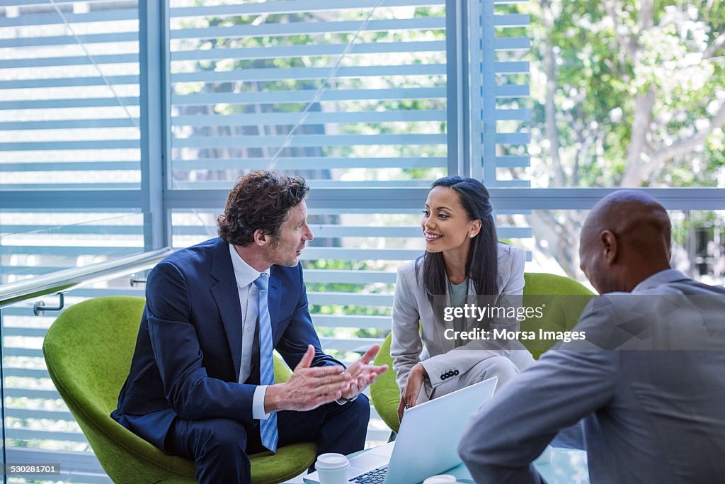 Businessman discussing strategy with colleague